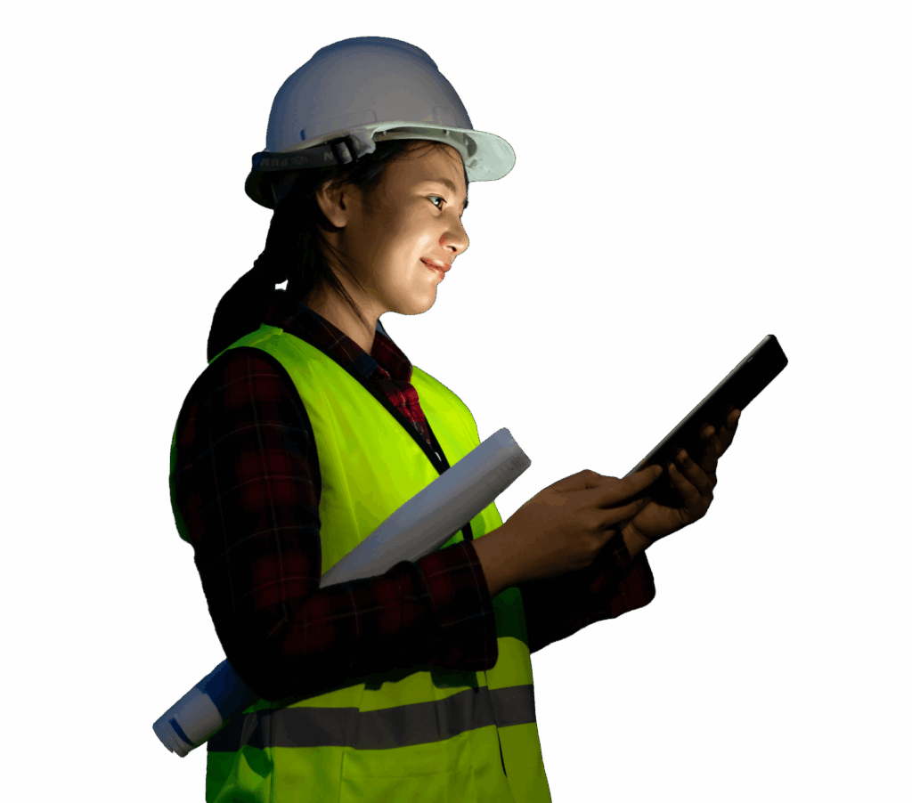 Female construction worker wearing a hard hat and safety vest, holding blueprints and using a tablet.