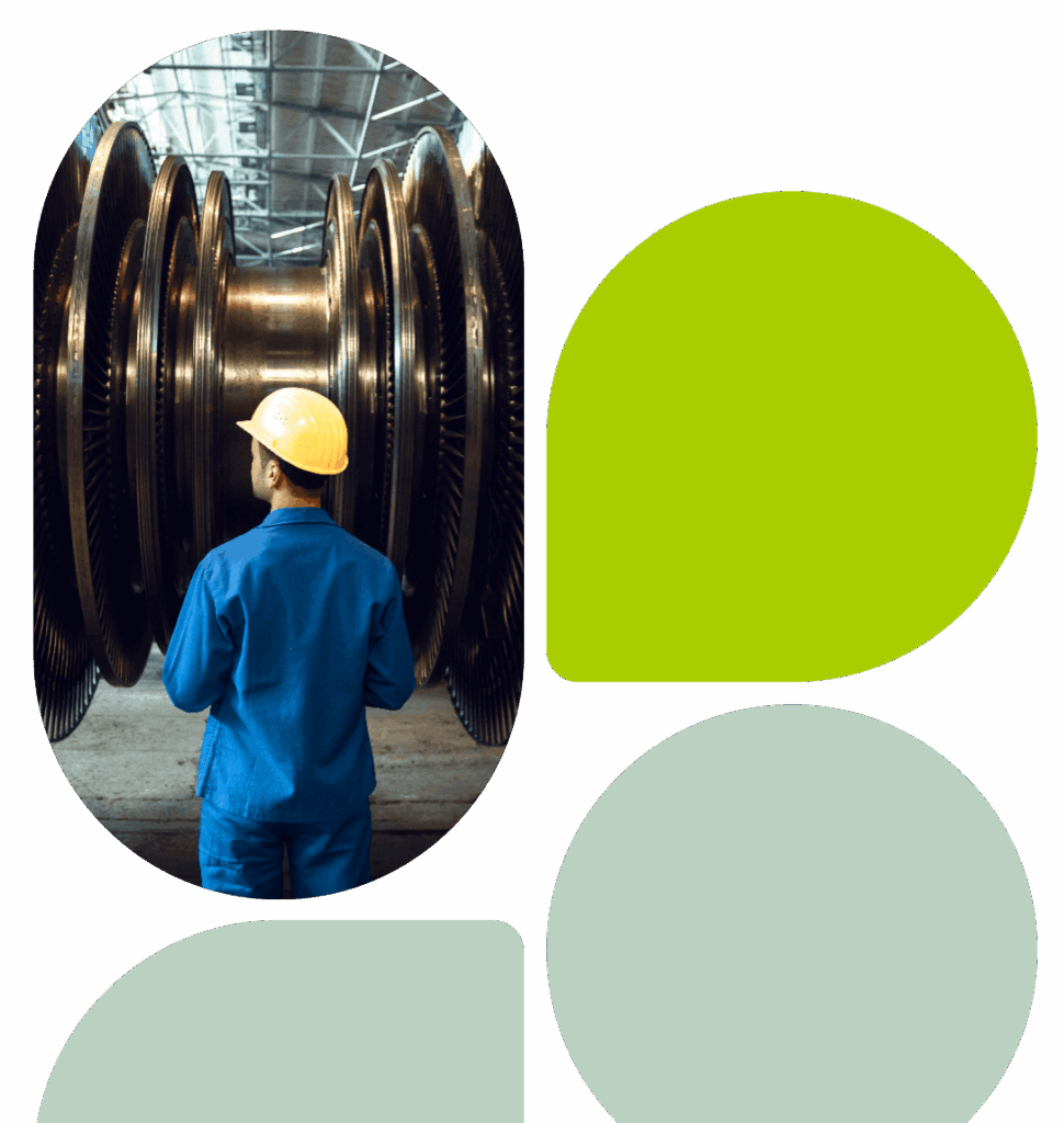 Worker in blue uniform and yellow hard hat inspecting turbine blades in a factory, with abstract green and grey geometric design elements.